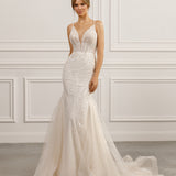 Sleeveless mermaid gown - Plunging neckline bridal dress - Intricate beadwork dress - Fitted silhouette - Tulle skirt - Elegant wedding dress - Formal bridal gown - Modern sophisticated dress - Timeless beauty gown - Dazzling wedding attire