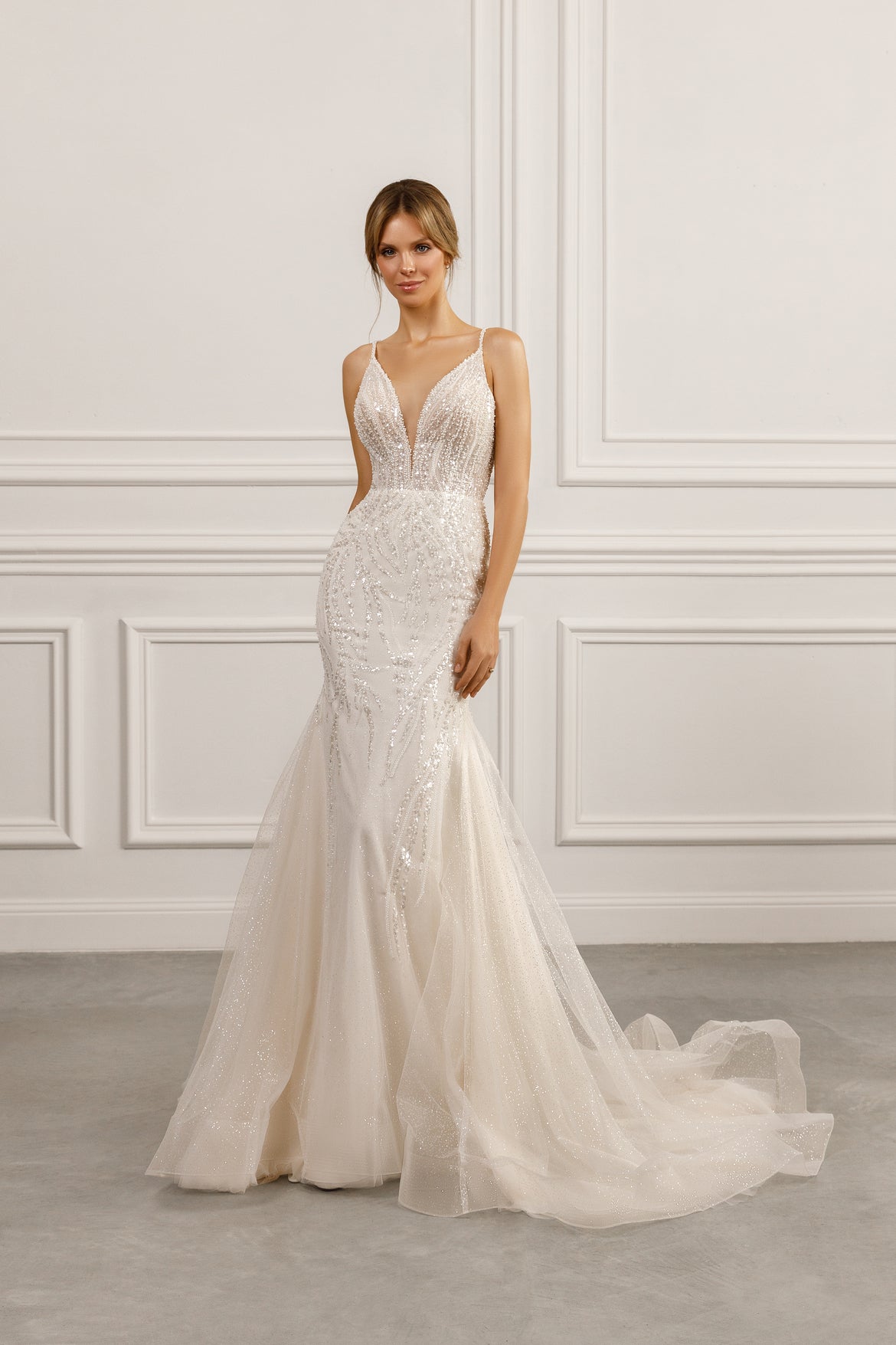 Sleeveless mermaid gown - Plunging neckline bridal dress - Intricate beadwork dress - Fitted silhouette - Tulle skirt - Elegant wedding dress - Formal bridal gown - Modern sophisticated dress - Timeless beauty gown - Dazzling wedding attire