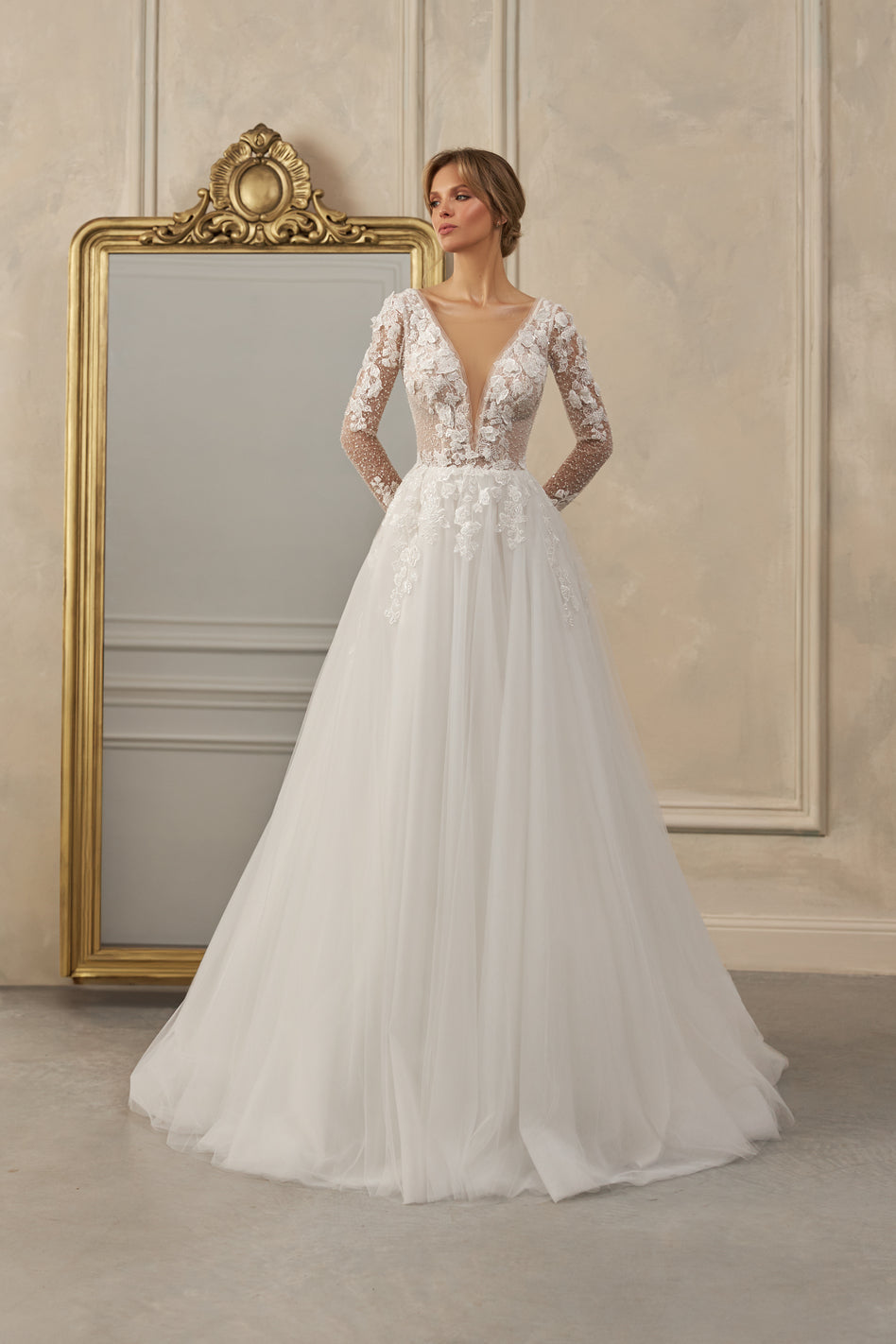 Long-sleeve A-line gown - Plunging neckline bridal dress - Floral lace appliqué dress - Sheer lace sleeves - Fitted bodice - Full tulle skirt - Elegant wedding dress - Formal bridal gown - Timeless beauty gown - Romantic wedding attire