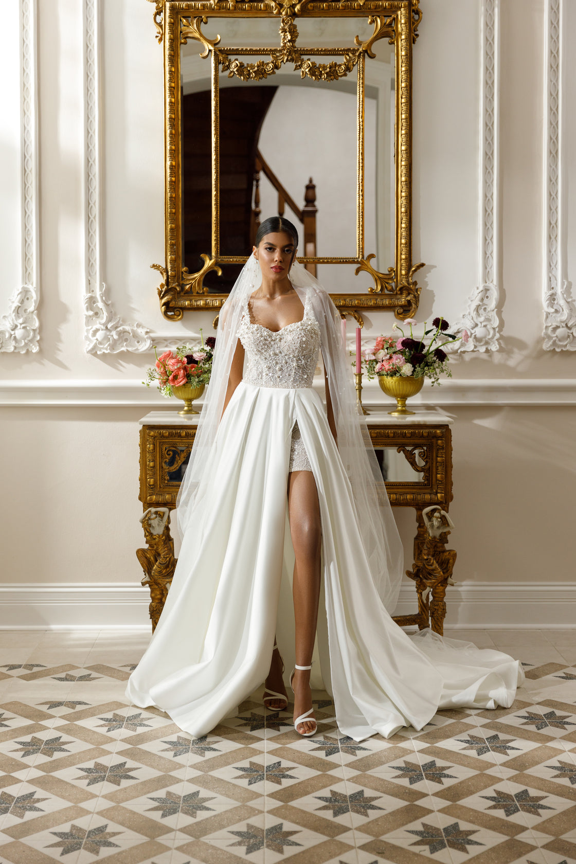 High-low gown - Sweetheart neckline bridal dress - Floral lace appliqué dress - Sparkling beadwork dress - Open-front skirt - Embellished underlay - Elegant wedding dress - Formal bridal gown - Modern sophisticated dress - Unique wedding attire