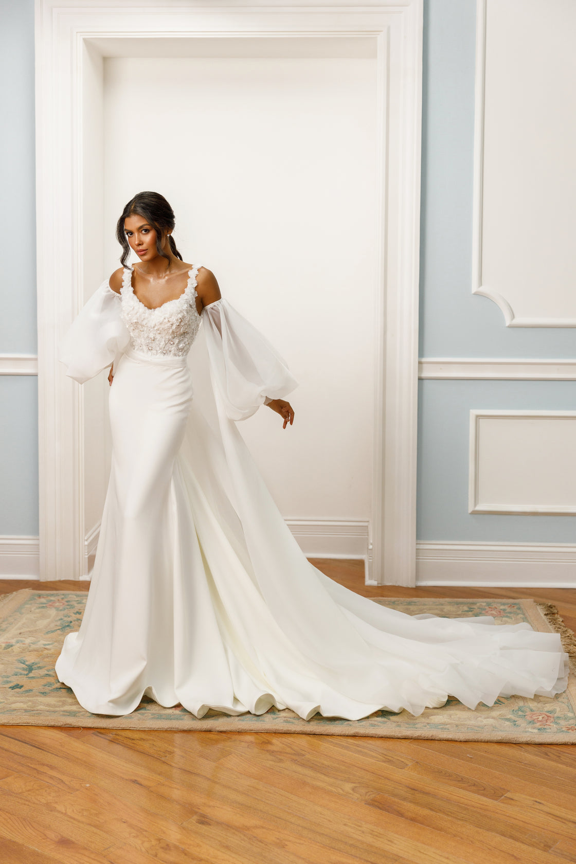 Off-the-shoulder gown - Sweetheart neckline bridal dress - Floral lace appliqué dress - Bishop sleeves wedding dress - Fitted silhouette - Elegant wedding dress - Formal bridal gown - Romantic wedding attire - Sophisticated wedding gown - Train wedding dress