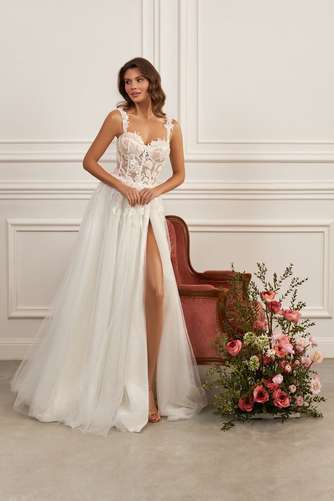 Sleeveless A-line gown - Plunging neckline bridal dress - Floral lace appliqué dress - Sheer corset bodice - Delicate straps - High slit skirt - Elegant wedding dress - Formal bridal gown - Modern romantic dress - Sophisticated wedding attire