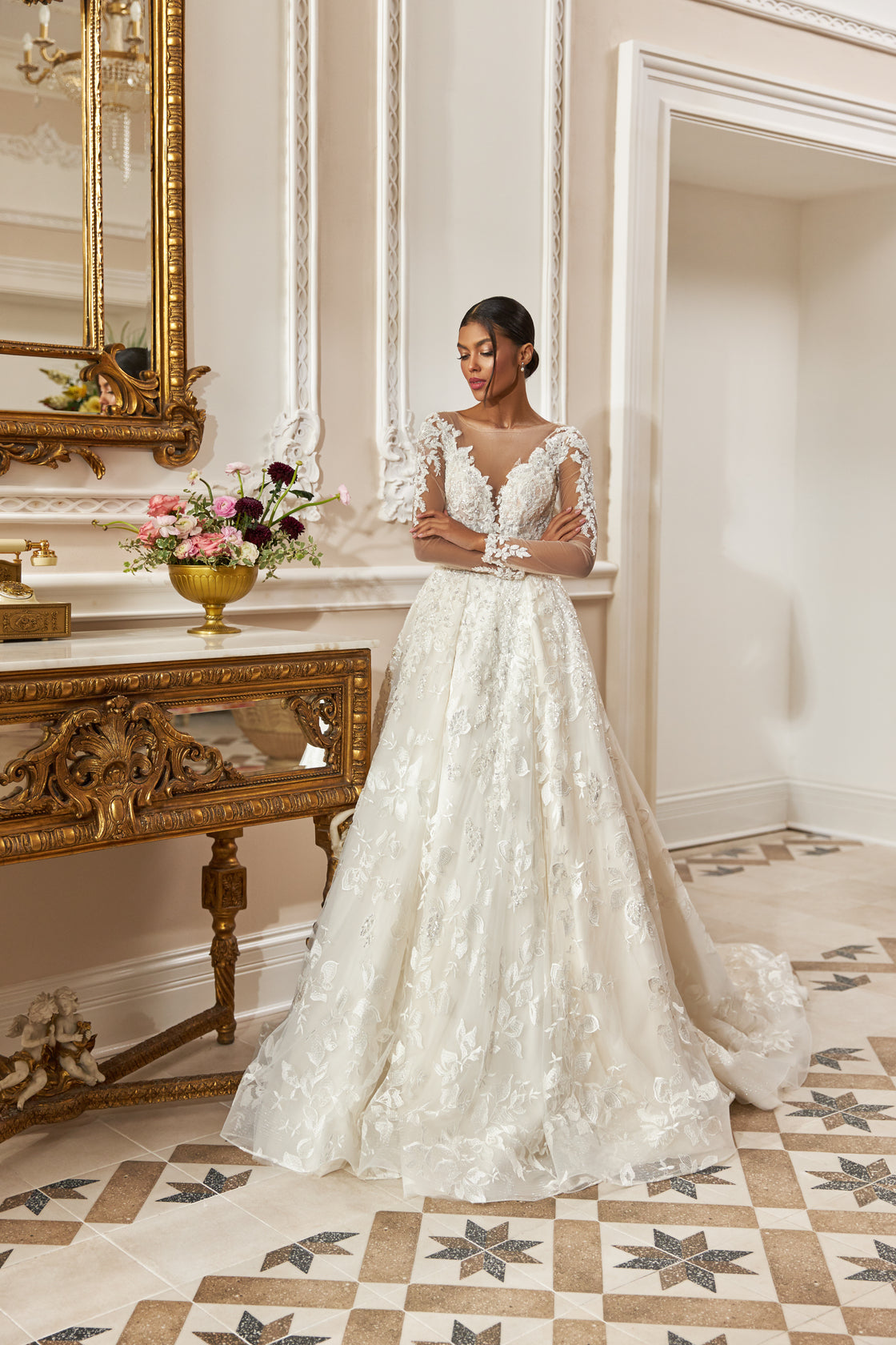 A-line gown - Illusion neckline bridal dress - Long sheer sleeves - Floral lace appliqué dress - Fitted bodice with lace - Flowing tulle skirt - Elegant wedding dress - Formal bridal gown - Romantic wedding attire - Timeless beauty gown