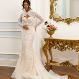 Long-sleeve mermaid gown - High neck bridal dress - Floral lace appliqué dress - Unique cut-out detail - Fitted bodice with lace - Mermaid silhouette with train - Elegant wedding dress - Formal bridal gown - Sophisticated wedding attire - Modern classic gown