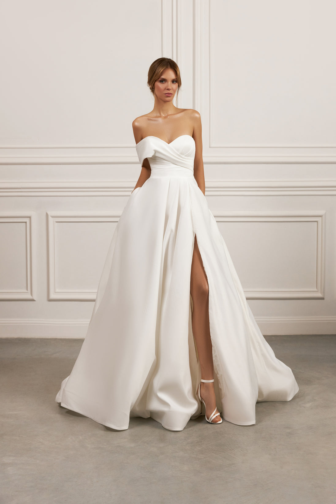 Strapless A-line gown - Sweetheart neckline bridal dress - Crossover bodice dress - High slit wedding dress - Minimalist wedding gown - Fitted bodice - Voluminous skirt - Elegant wedding dress - Formal bridal gown - Modern sophisticated dress