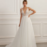 Sleeveless A-line gown - Plunging neckline bridal dress - Lace and beadwork dress - Bow-tied shoulder straps - Fitted bodice with lace - Voluminous tulle skirt - Elegant wedding dress - Formal bridal gown - Modern sophisticated dress - Timeless beauty gown