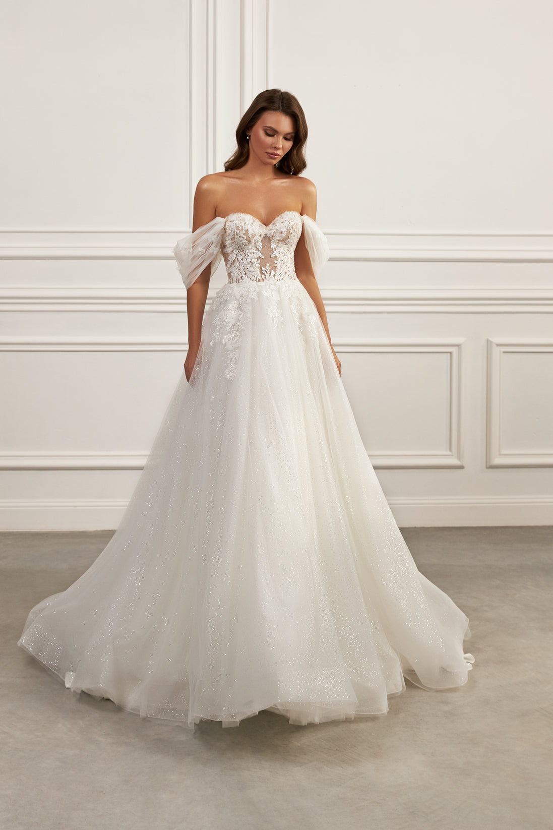 Off-the-shoulder ball gown - Sweetheart neckline bridal dress - Floral lace appliqué dress - Tulle puff sleeves - Semi-sheer bodice - Full ball gown skirt - Elegant wedding dress - Formal bridal gown - Romantic wedding attire - Timeless beauty gown