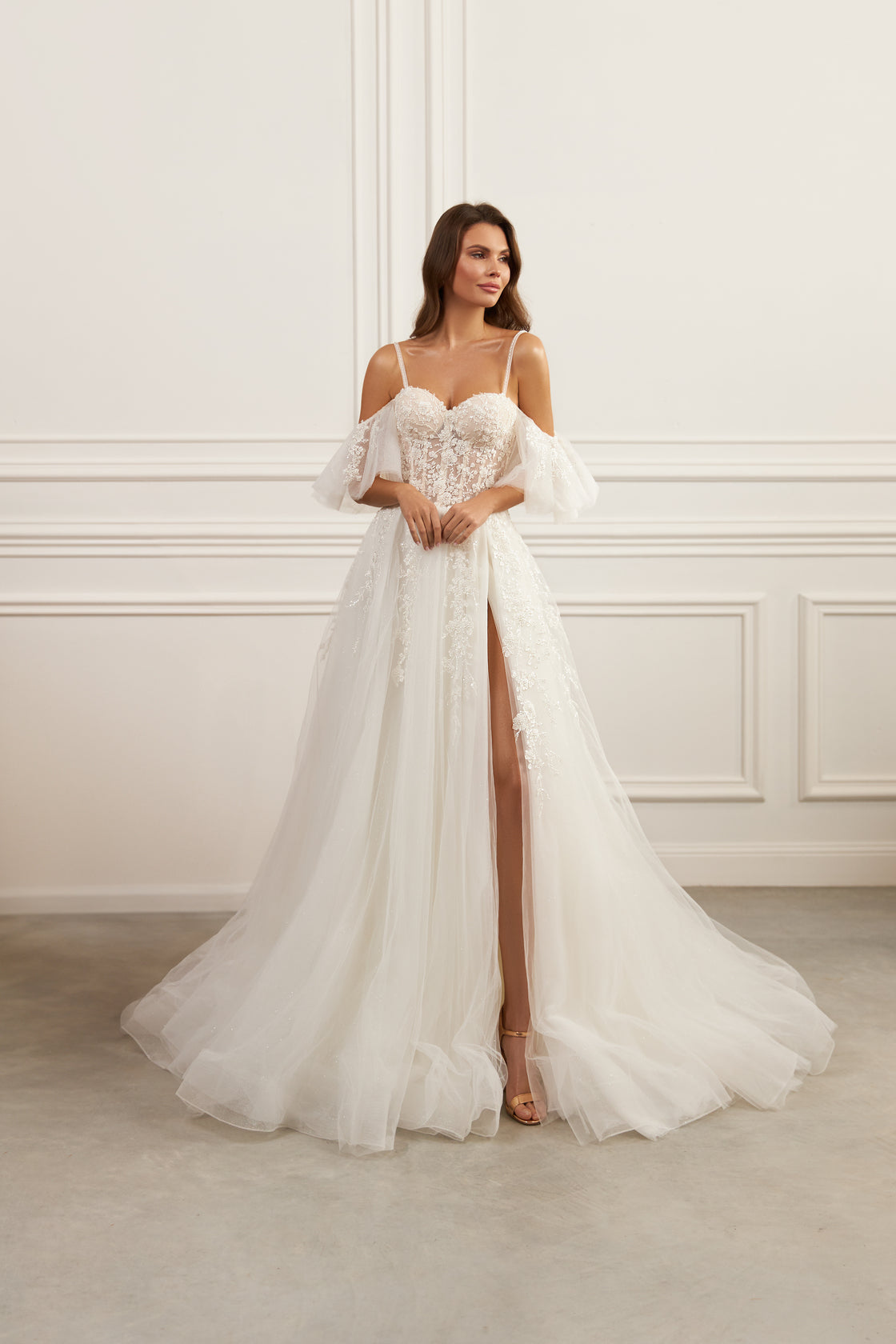 Off-the-shoulder wedding gown - Sweetheart neckline bridal dress - Spaghetti strap dress - Draped sleeve gown - Floral lace appliqué dress - Fitted bodice with lace - Flowing tulle skirt - High slit wedding dress - Ethereal wedding dress - Romantic bridal gown