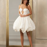 Strapless short dress - Sweetheart neckline with cutout - Voluminous bubble skirt - Playful bridal dress - Fun and flirty wedding dress - Informal wedding attire - Elegant reception dress - Contemporary bridal gown - Whimsical wedding dress - Unique bridal style