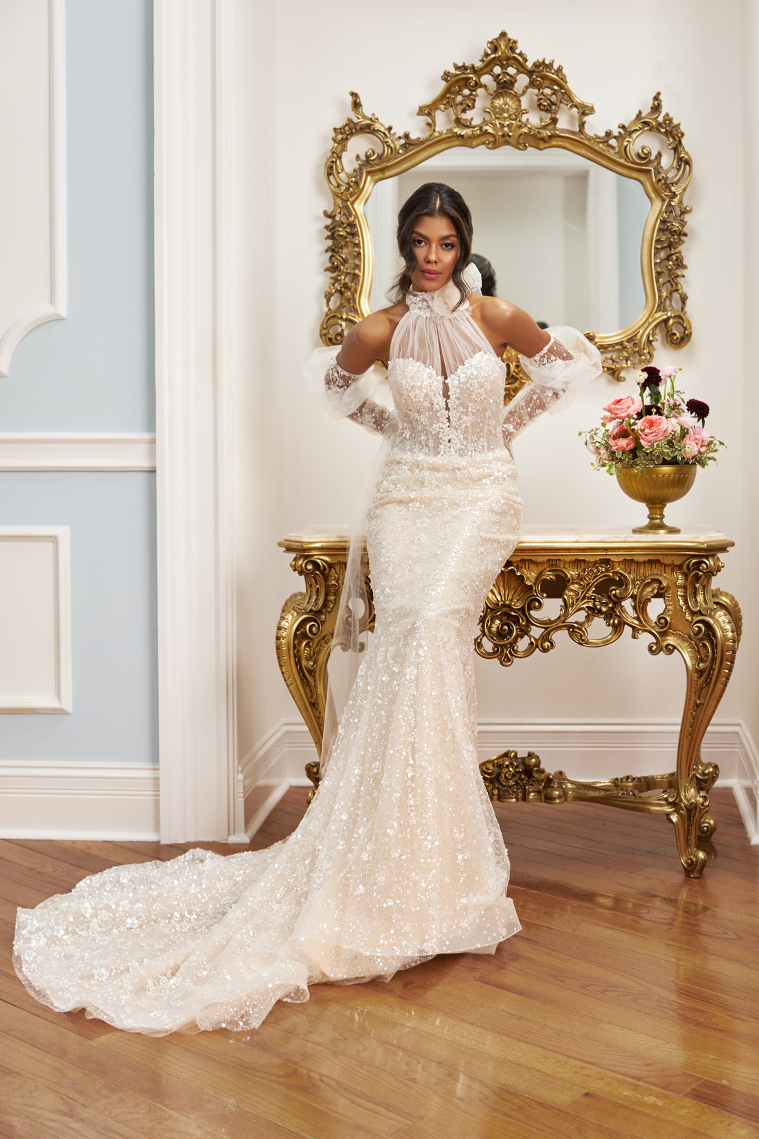 Halter neckline mermaid gown - Illusion sleeves bridal dress - Lace and beading appliqué dress - Fitted bodice with sheer overlay - Mermaid silhouette with train - Elegant wedding dress - Formal bridal gown - Modern sophisticated dress - Dramatic wedding gown - Timeless elegance gown